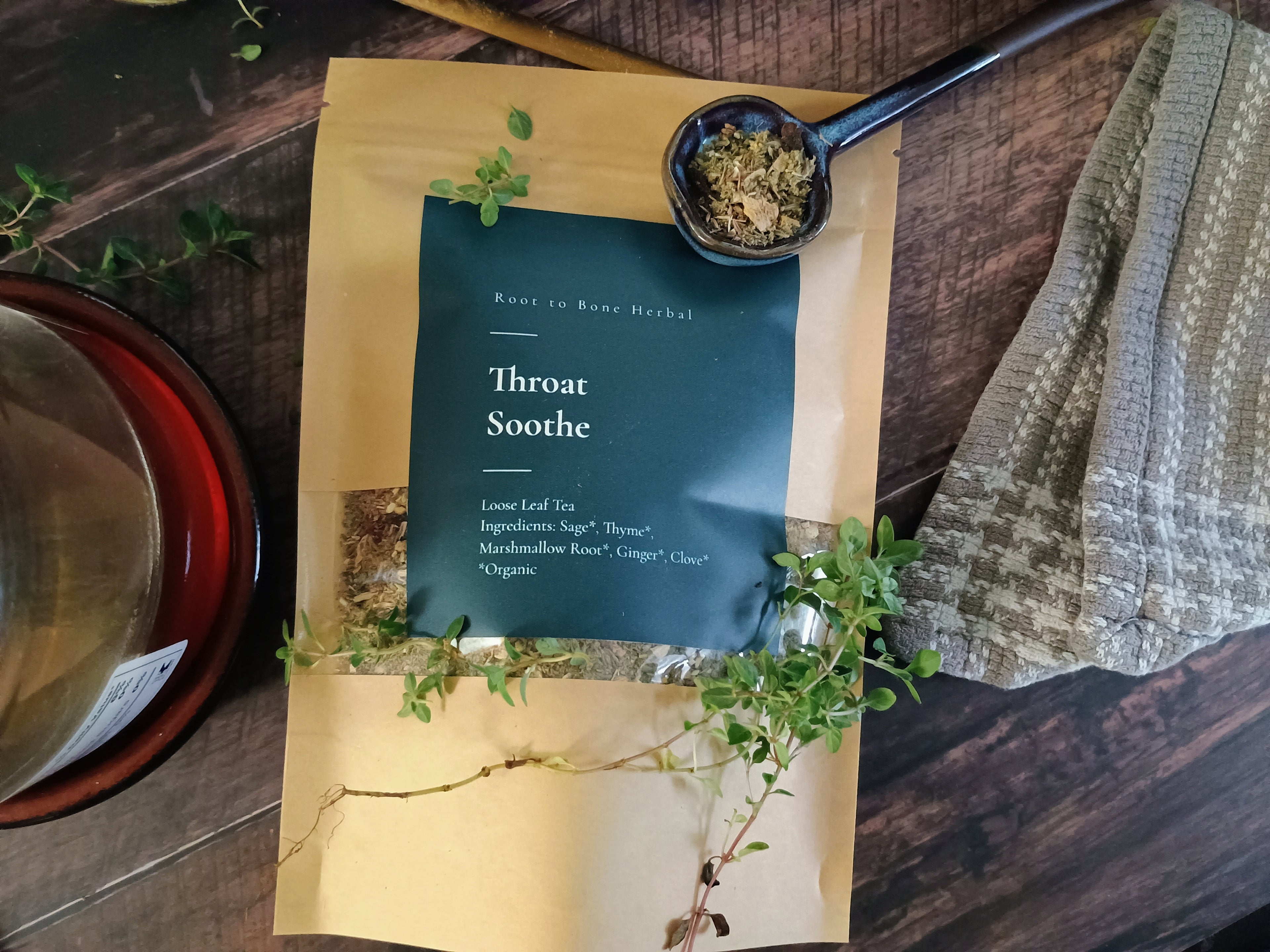 Throat soothe tea package with herbs on a wooden surface