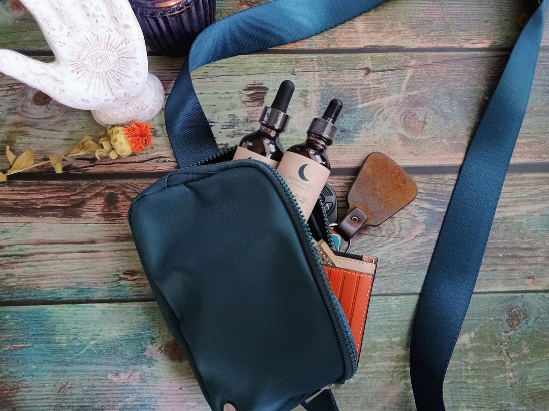 purse with spilled contents: keys, wallet, and 2 tincture bottles