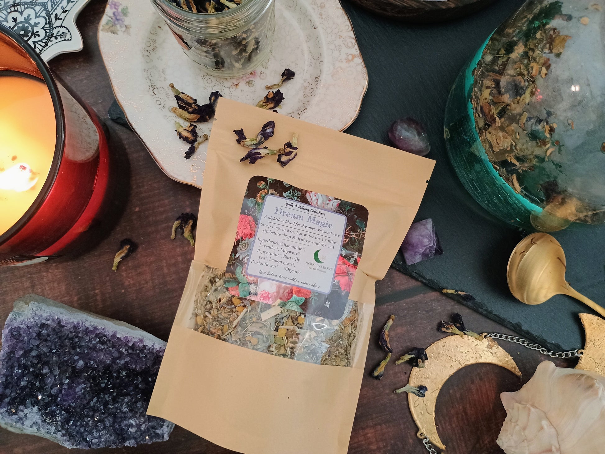 Herbal mix package on a table with candles, crystals, and decorative items