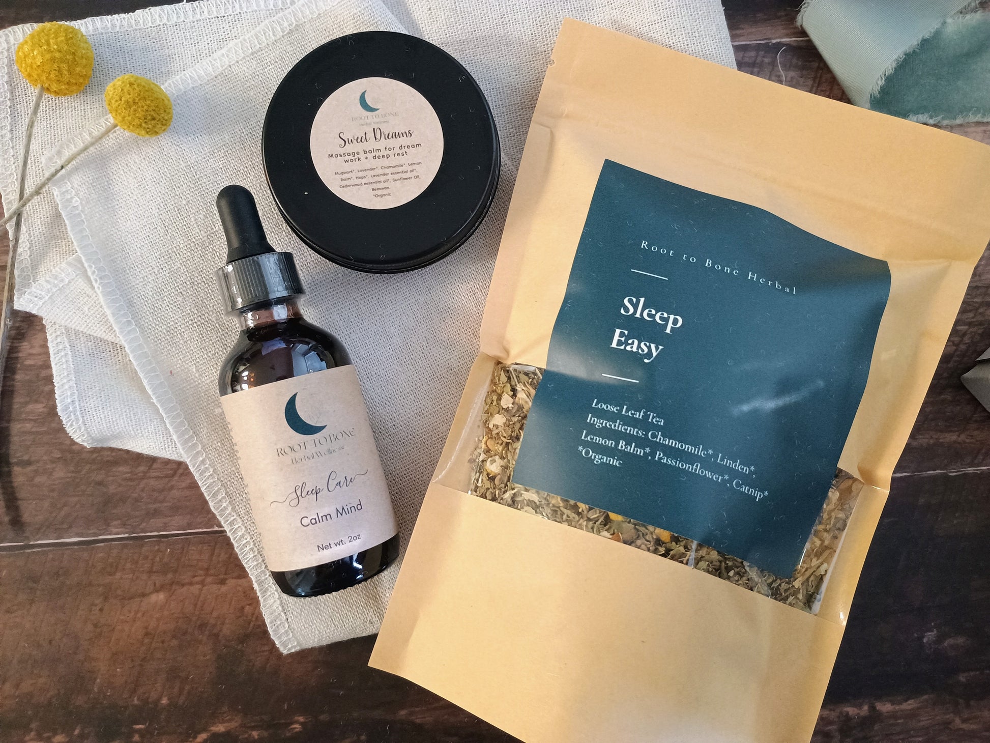 Herbal sleep supplement package with bottle, container, and packaging on a wooden surface.