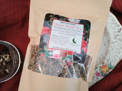 Heart-Mind Tea package with floral design and text on a red fabric background