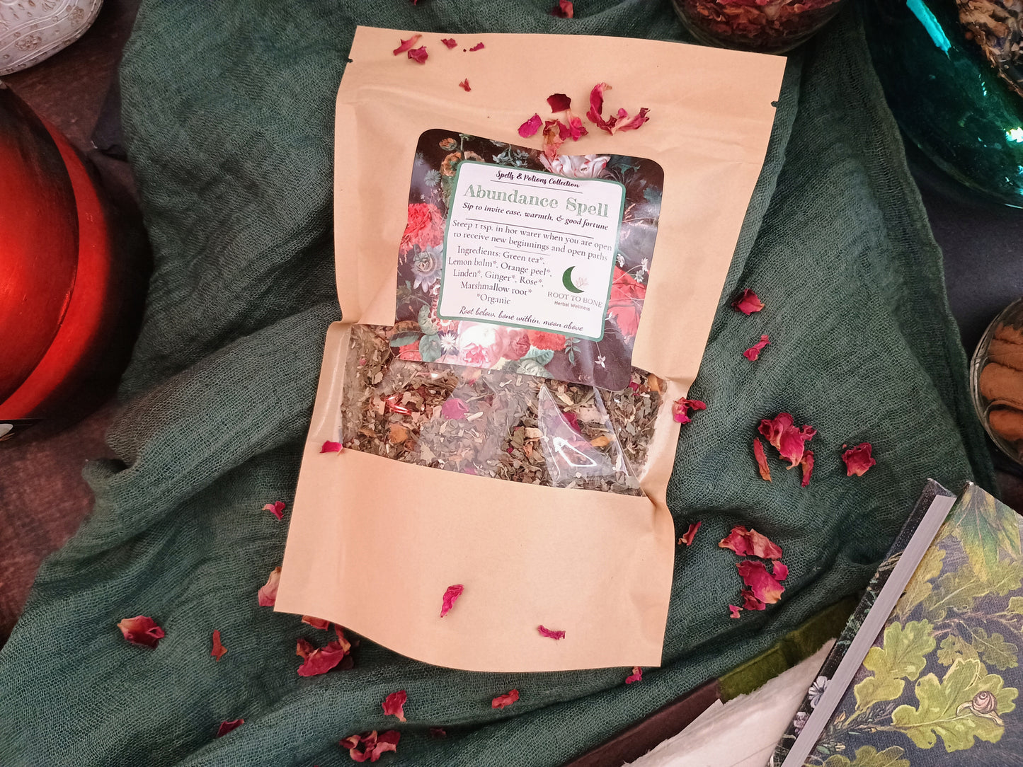 Open package of dried herbs with a label on a green fabric background