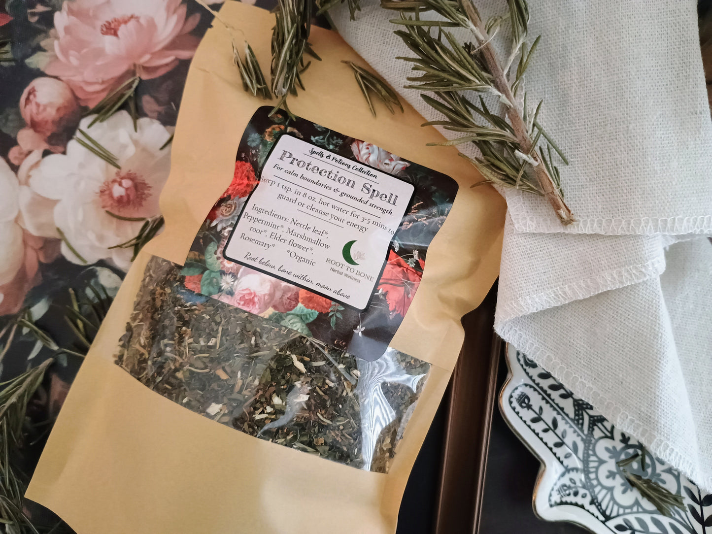 Herbal mixture in a brown envelope with a label on a floral and fabric background