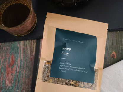 Sleep Easy tea package with a cup of tea on a textured surface