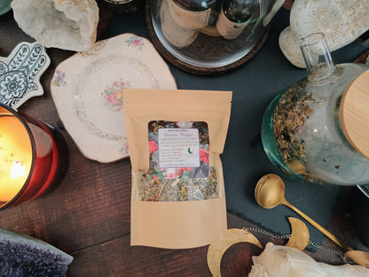 Herbal tea package on a table with candles and decorative items