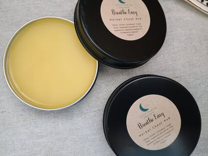 Two containers of 'Breathe Easy' herbal chest rub on a textured surface
