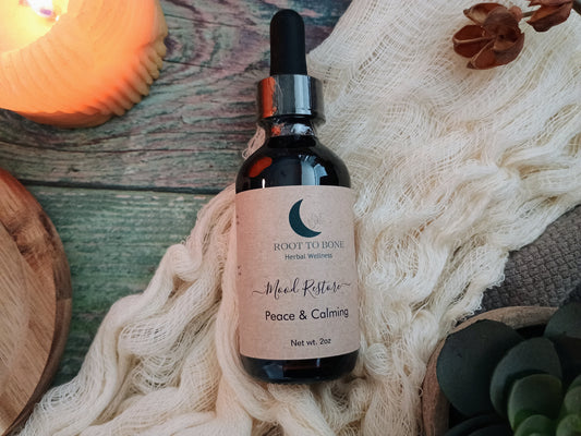 Bottle of 'Peace & Calming' herbal wellness supplement on a textured surface with decorative elements.