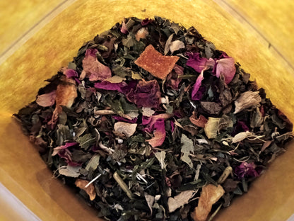 Assorted dried herbs and flowers in a wooden container