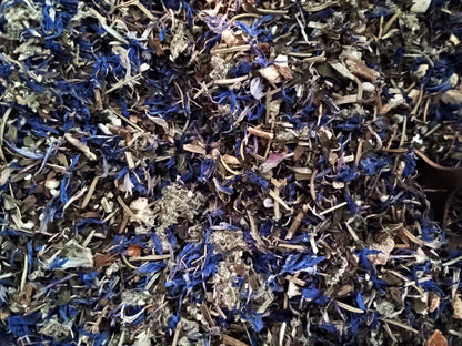 Close-up of a mix of dried herbs with blue and brown tones