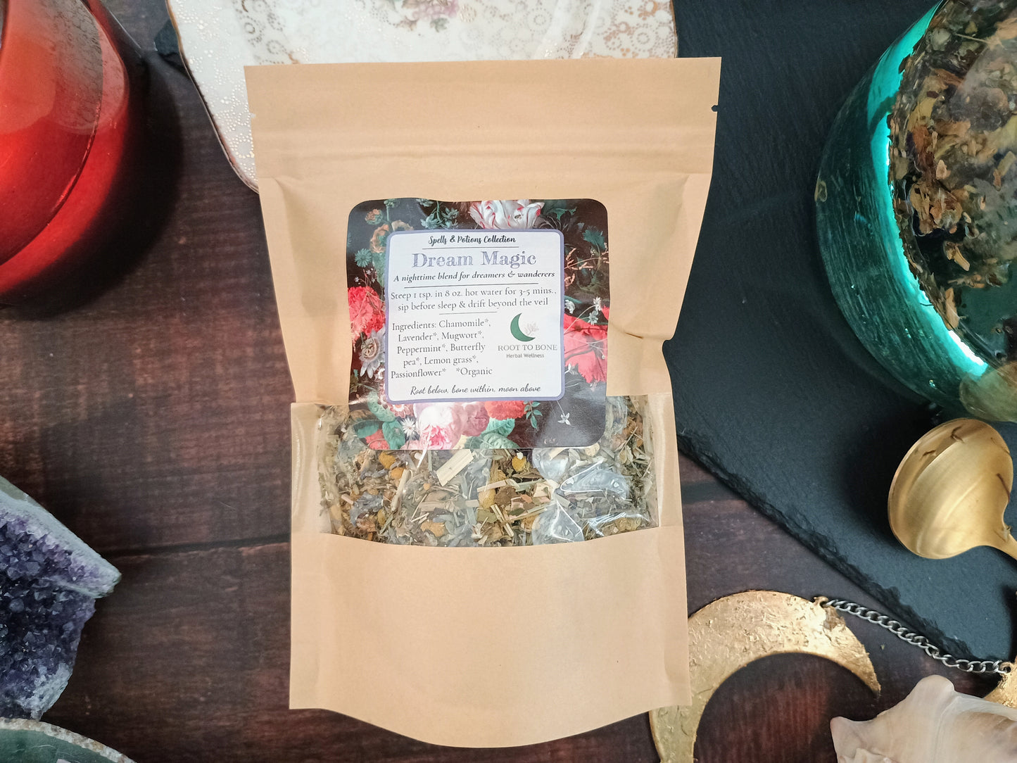 Herbal tea package labeled 'Dream Magic' on a wooden surface with decorative items.