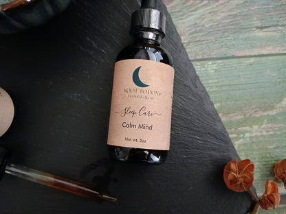 Bottle of 'Calm Mind' with a label on a dark surface