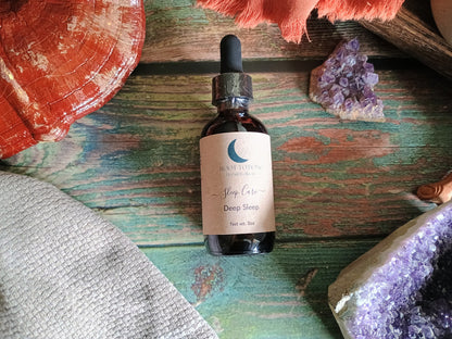 Bottle of 'Sleep Care' serum on a wooden surface with natural elements